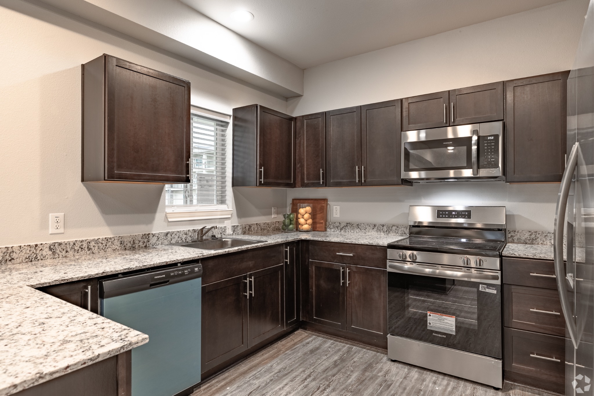 Kitchen with granite counters and stainless-steel appliances